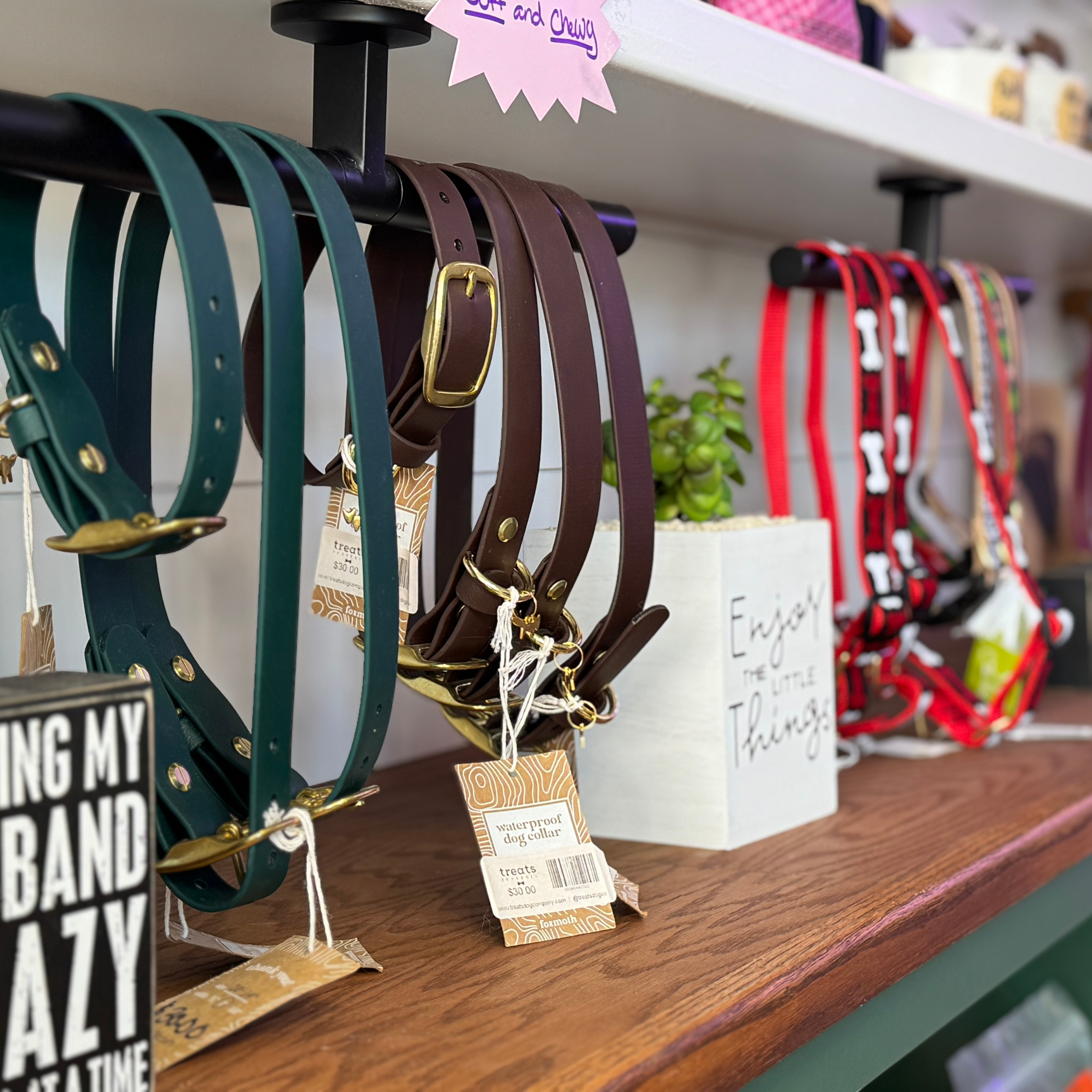 A selection of dog collars on the shelf at Treats Pupperia.
