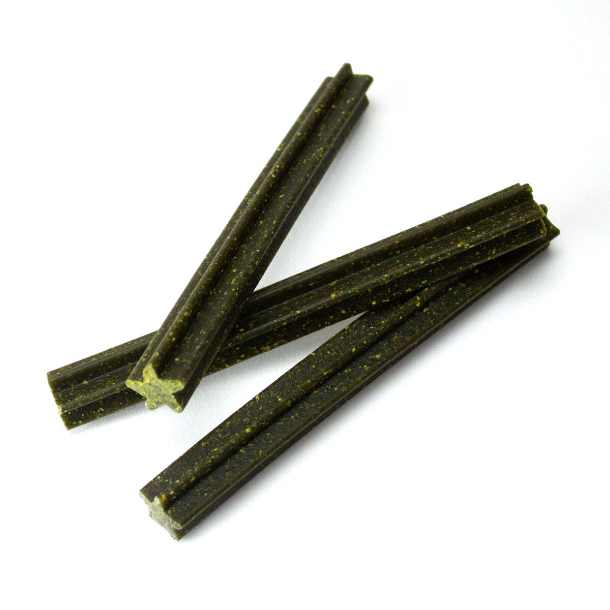 Three minty-green dog dental chews on a white background.