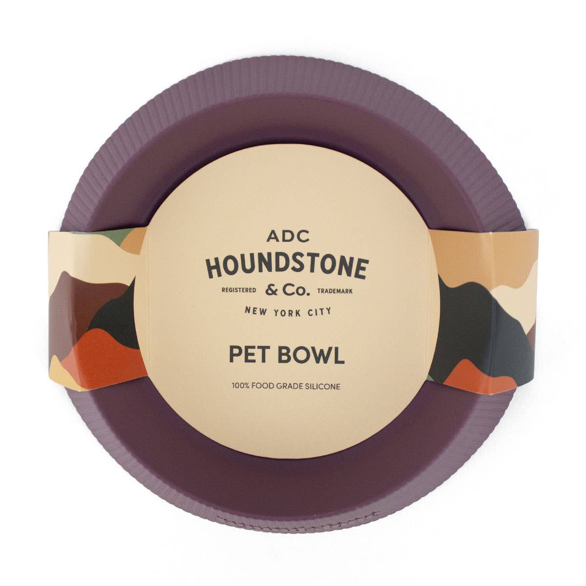 Plum colored silicone travel pet bowl on a white background.