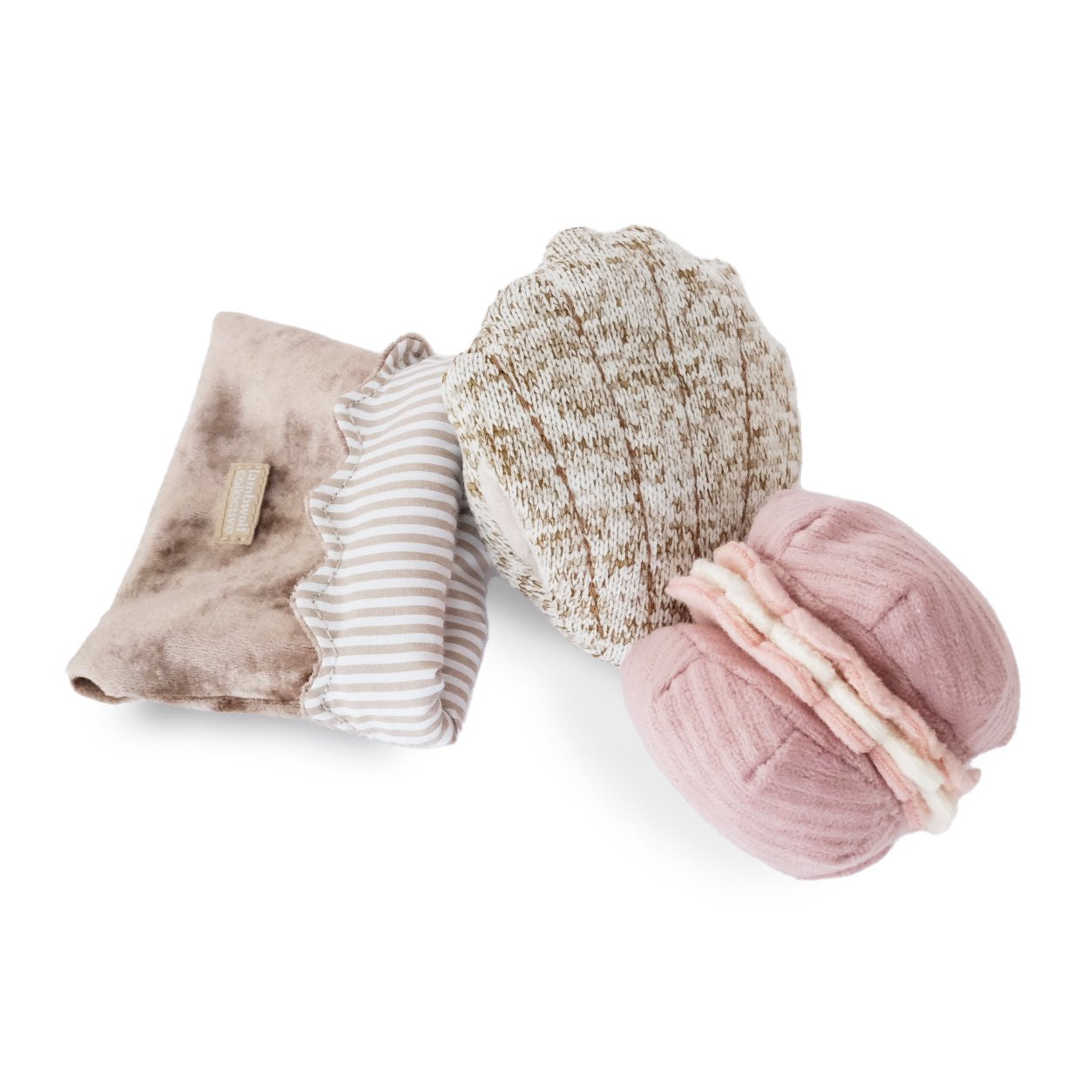 Set of plush snuffle dog toys shaped as a macaroon, a madeline with a small bag on a white background.