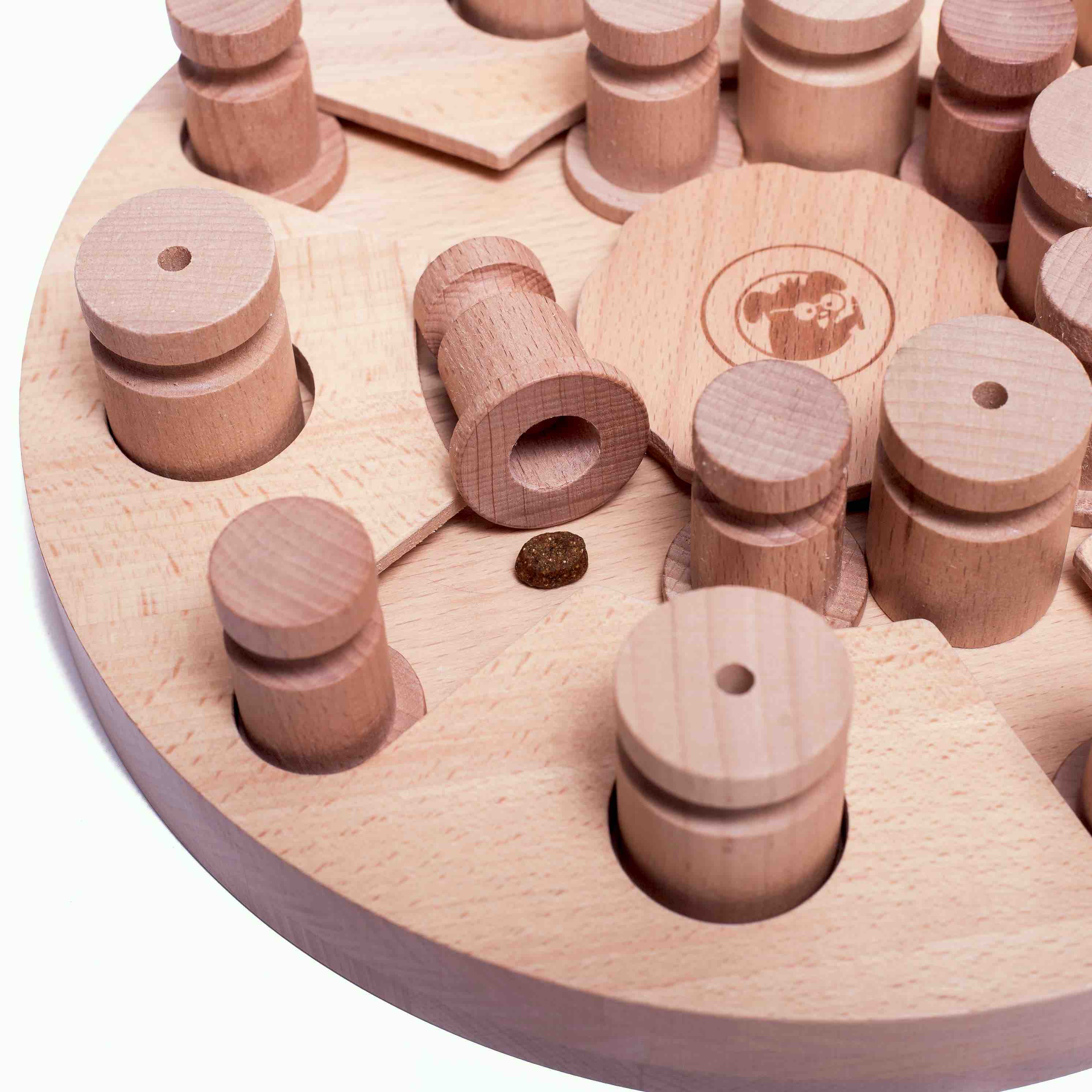 Wooden puzzle with cylindrical pieces on a circular base.