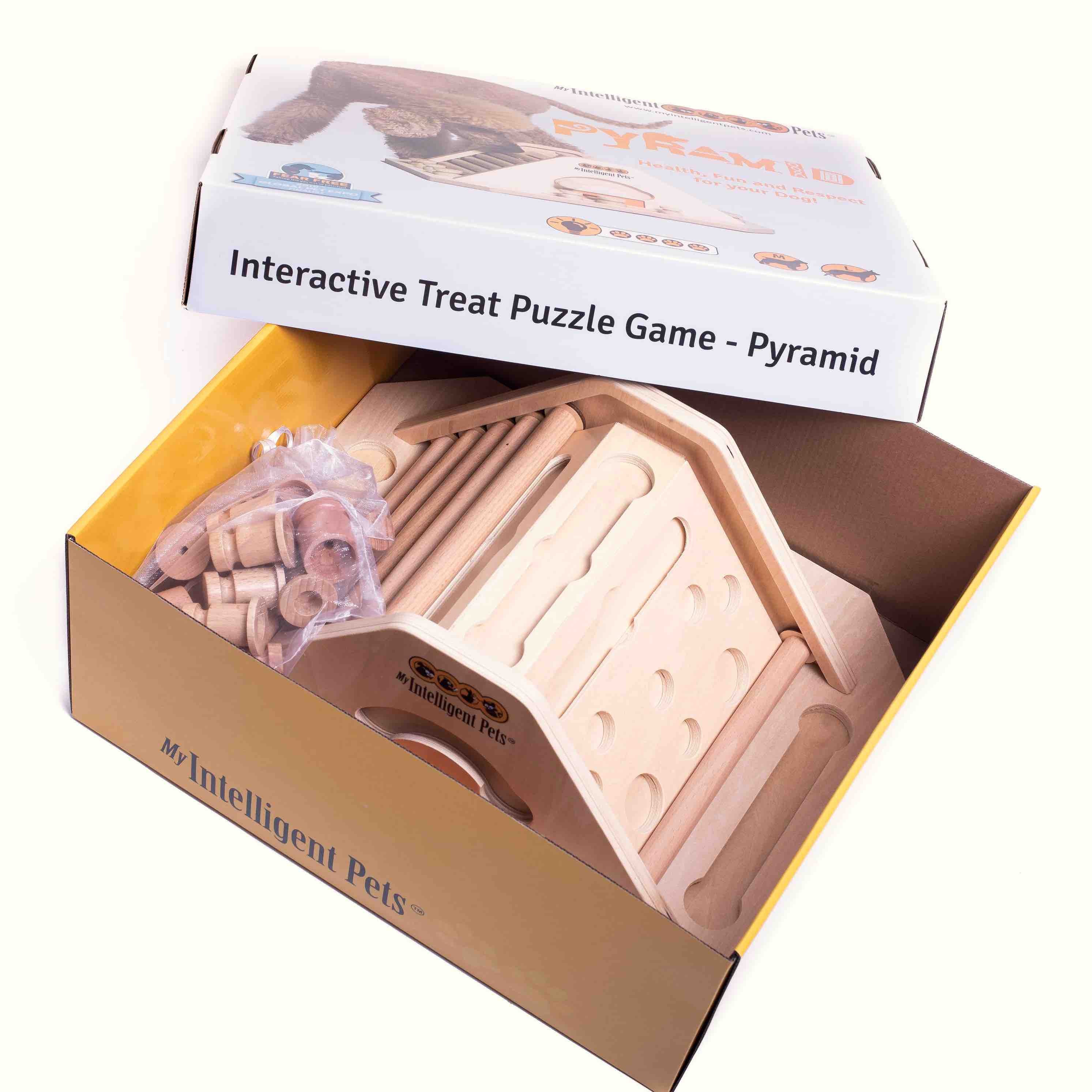 A wooden pyramid puzzle dog toy in its box.