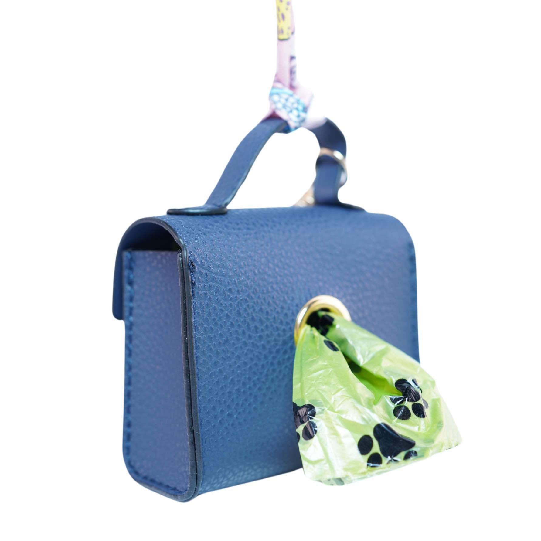Blue handbag-themed dog poop bag dispenser with a bag protruding from a hole in the back on a white background.