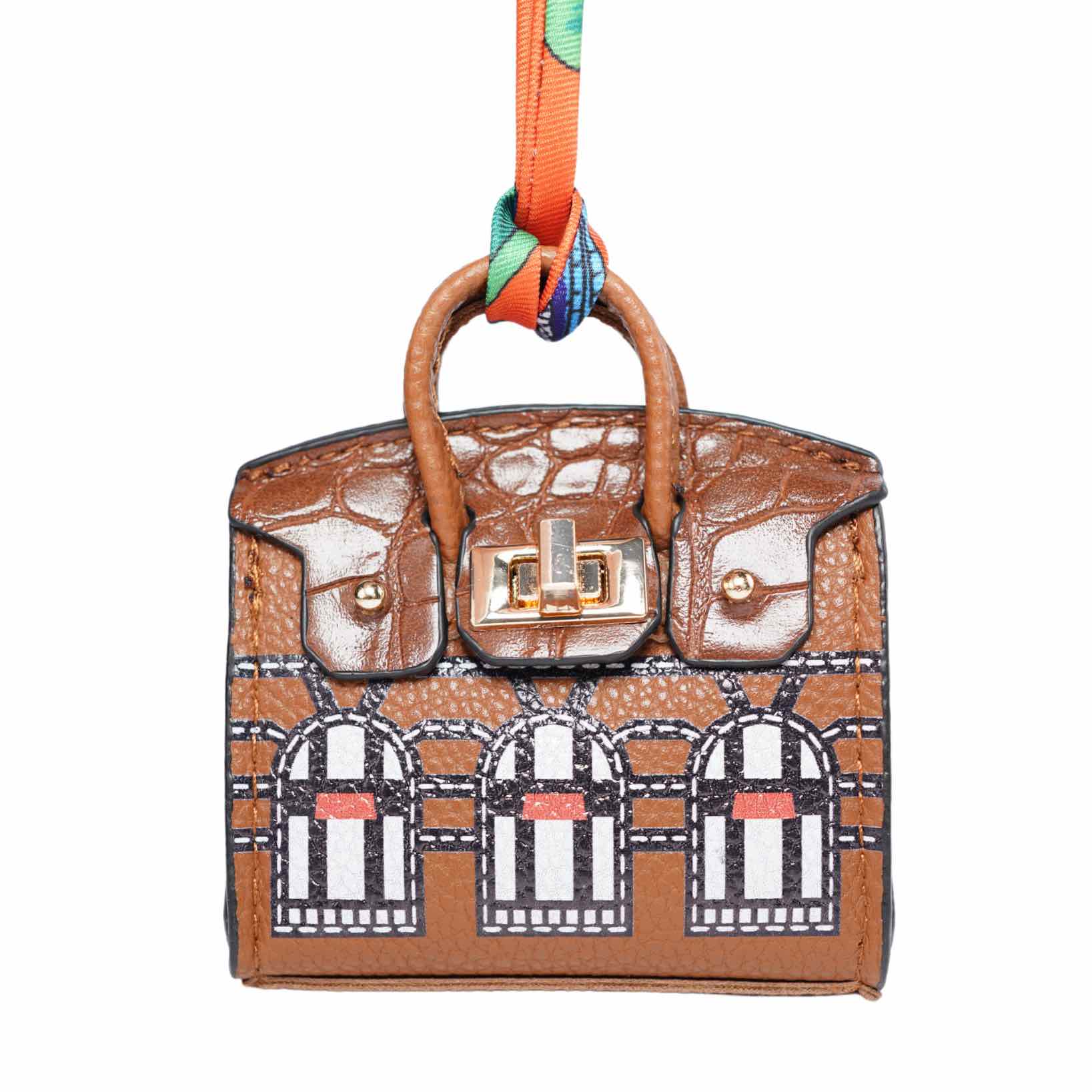 Brown handbag-style dog waste bag holder with architectural pattern on a white background.
