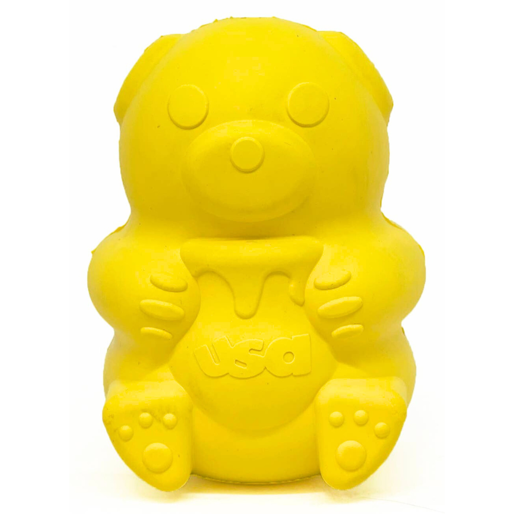 Yellow bear-shaped dog chew toy and treat dispenser with 'USA' text on a white background.