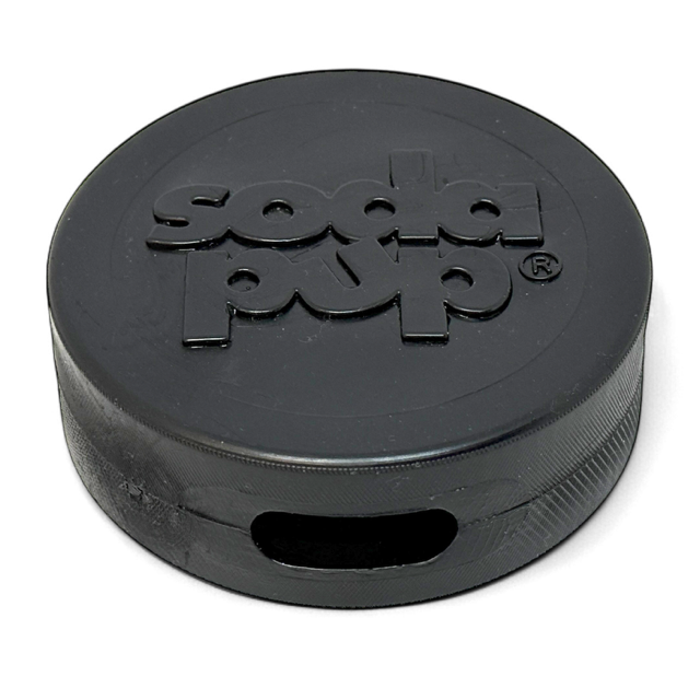 A black, rubber, hockey puck shaped dog chew toy with a hole through the side for a bully stick or other dog treat.