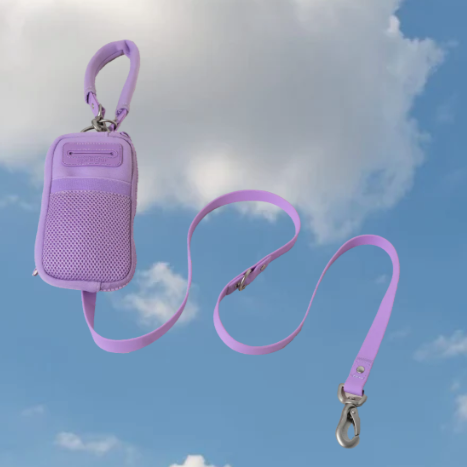 A lavender walk bag with dog leash on a sky background.