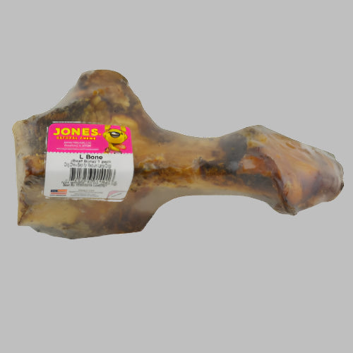 A beef L-bone dog treat wrapped in celophane.