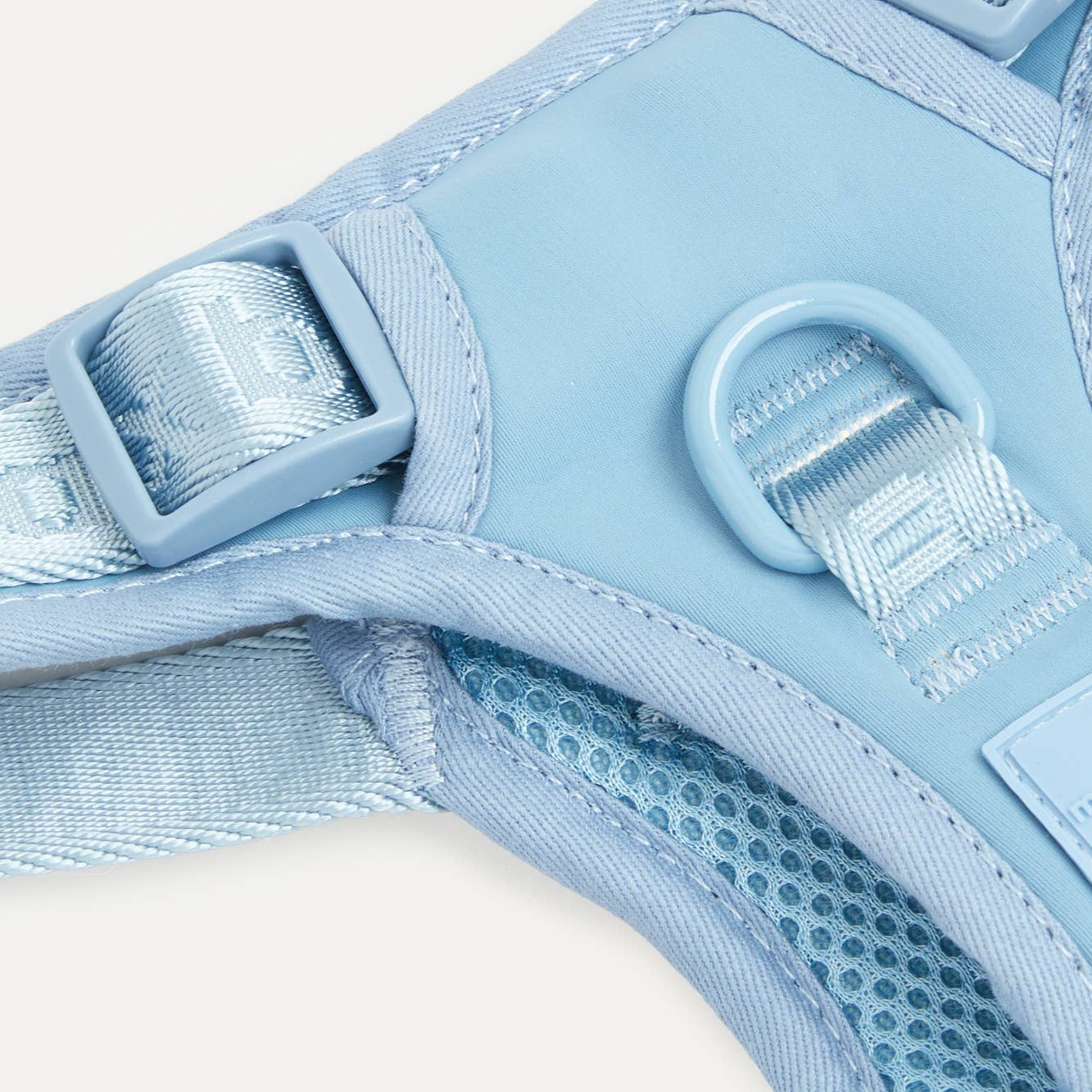 Detail of dusk blue Maxbone dog harness leash attachment.