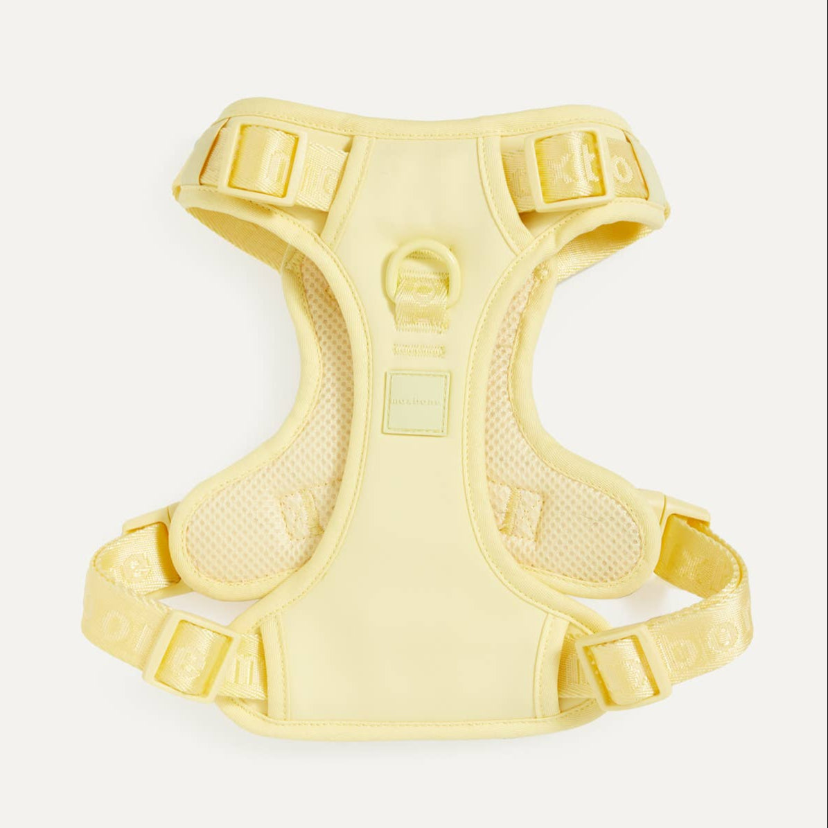 A yellow easy fit dog harness on a white background.