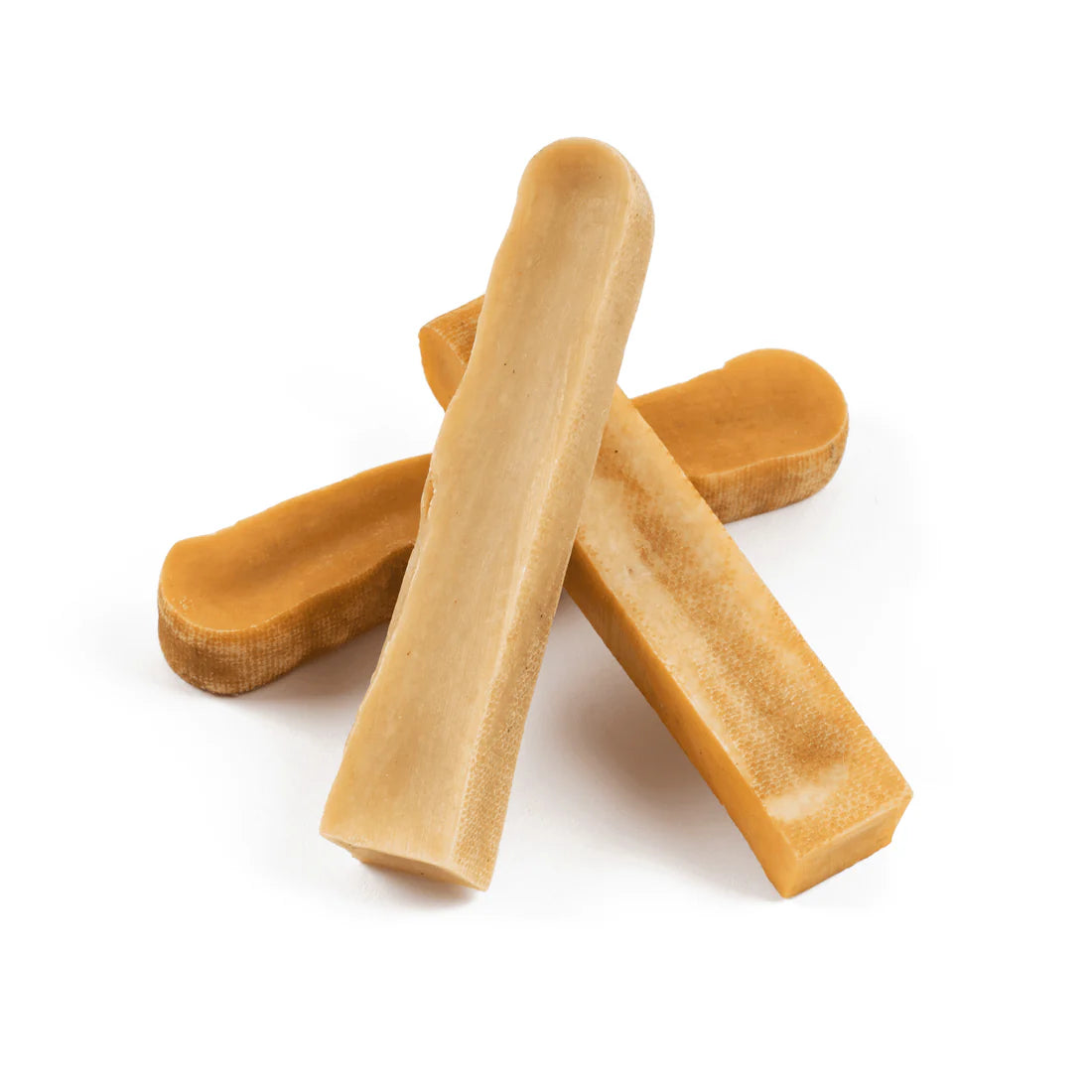 Yak milk chews on white background.