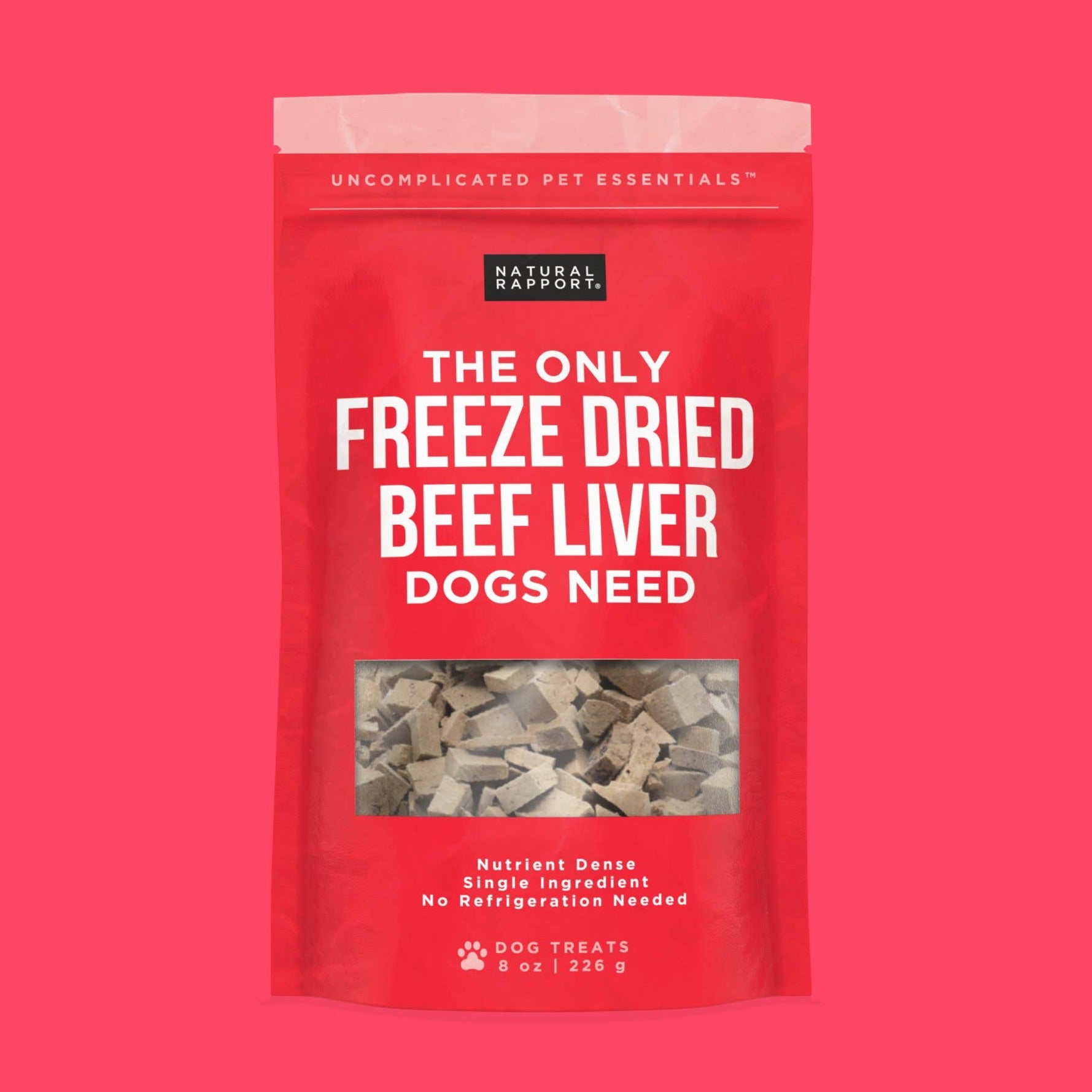 A red pouch of Natural Rapport Freeze-Dried beef liver dog treats on a fucsia background.