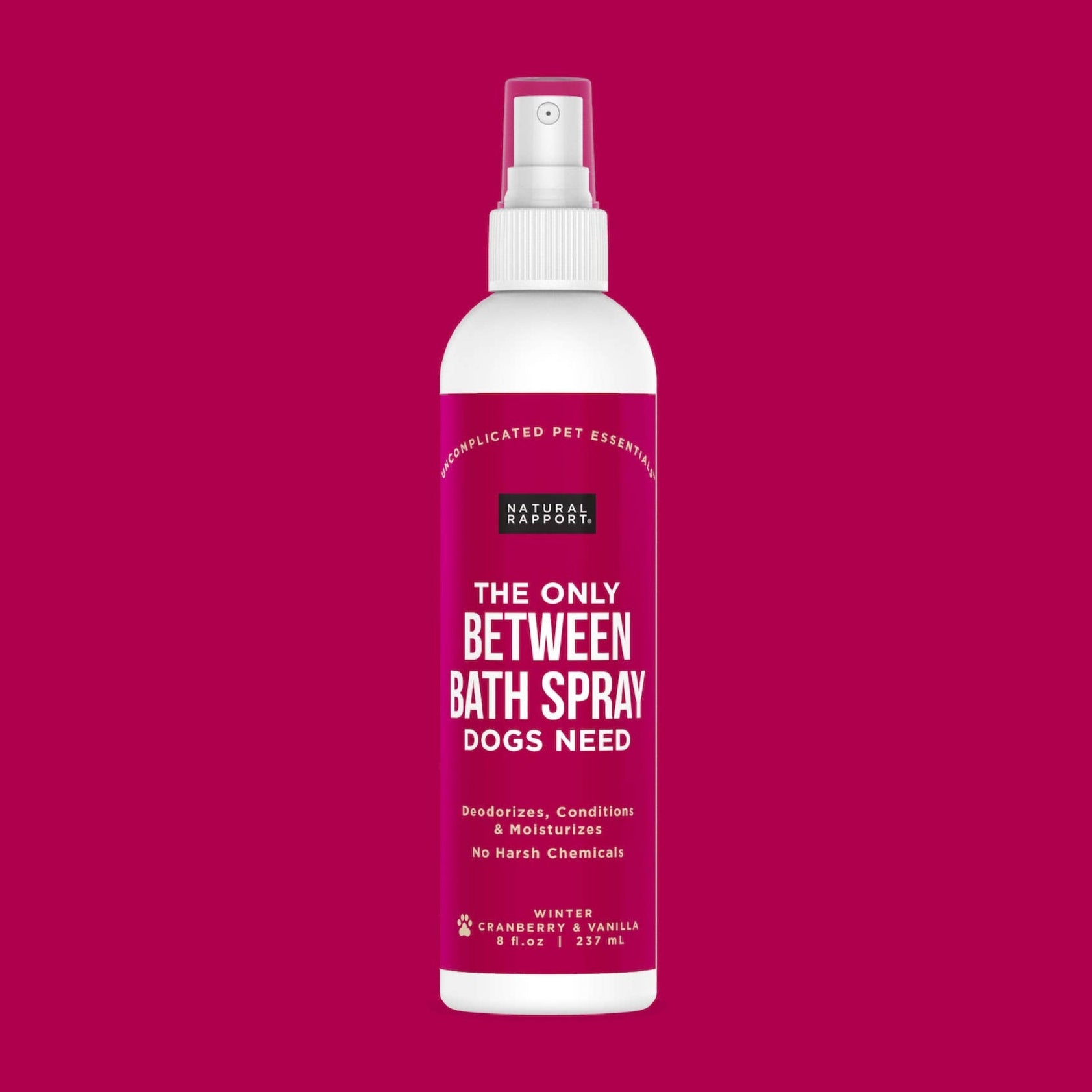 A bottle of Natural Rapport's cranberry and vanilla between bath spray.