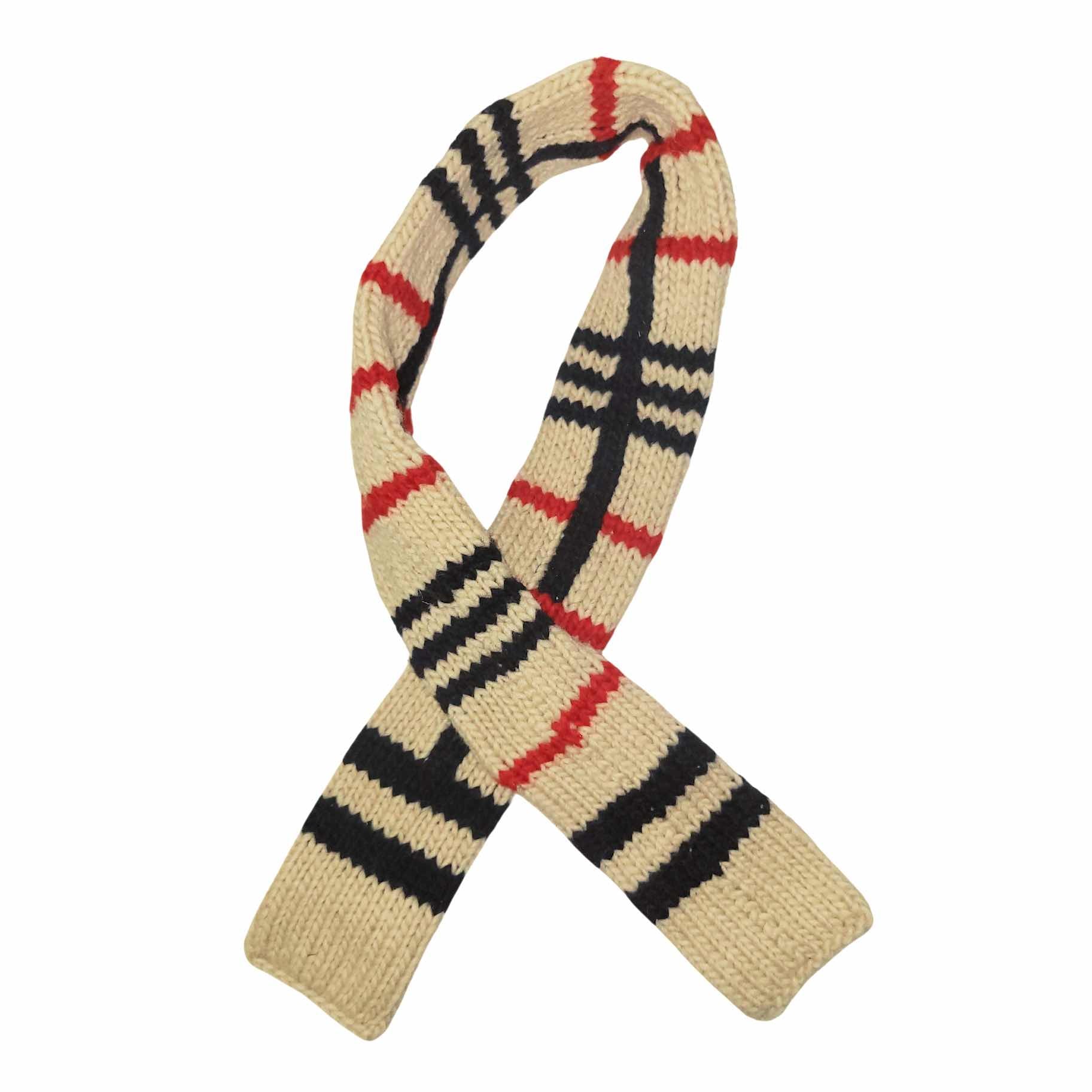 Knitted dog scarf with a stripe pattern on a white background.