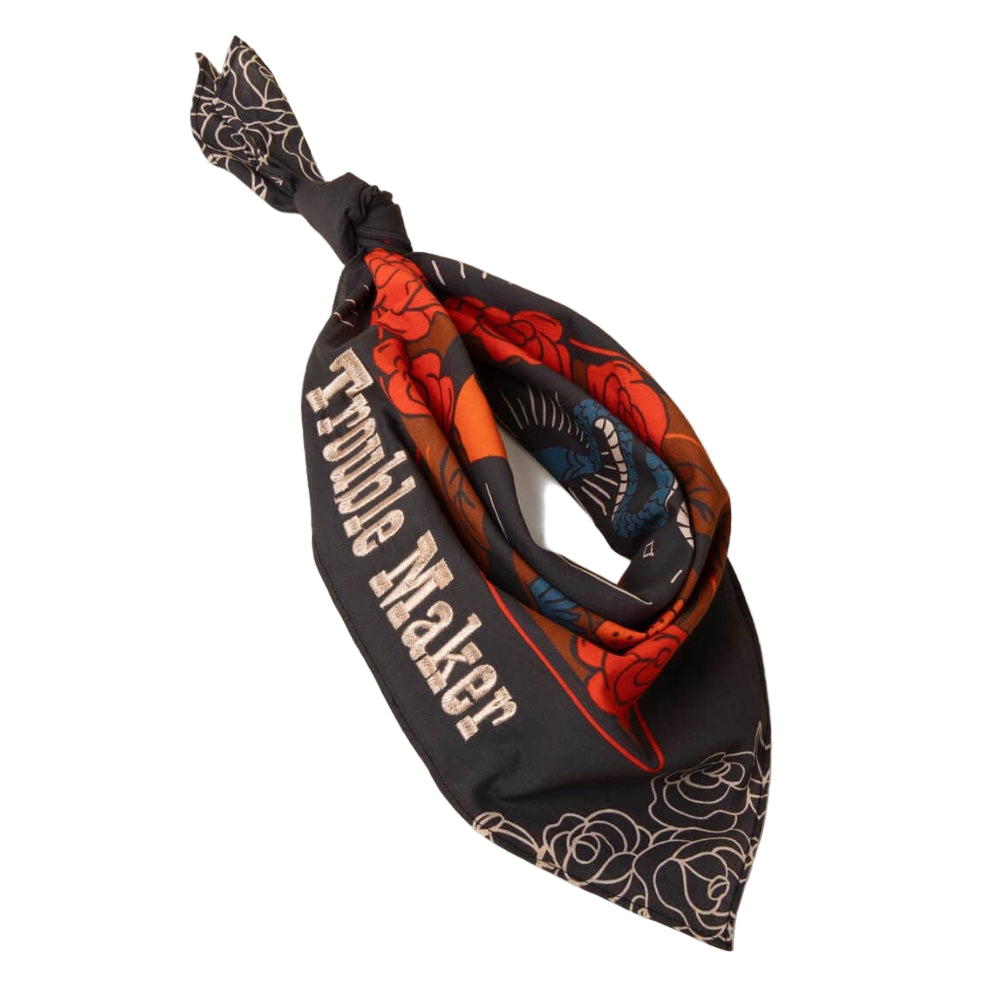 Dog bandana with floral patterns and 'Trouble Maker' text.
