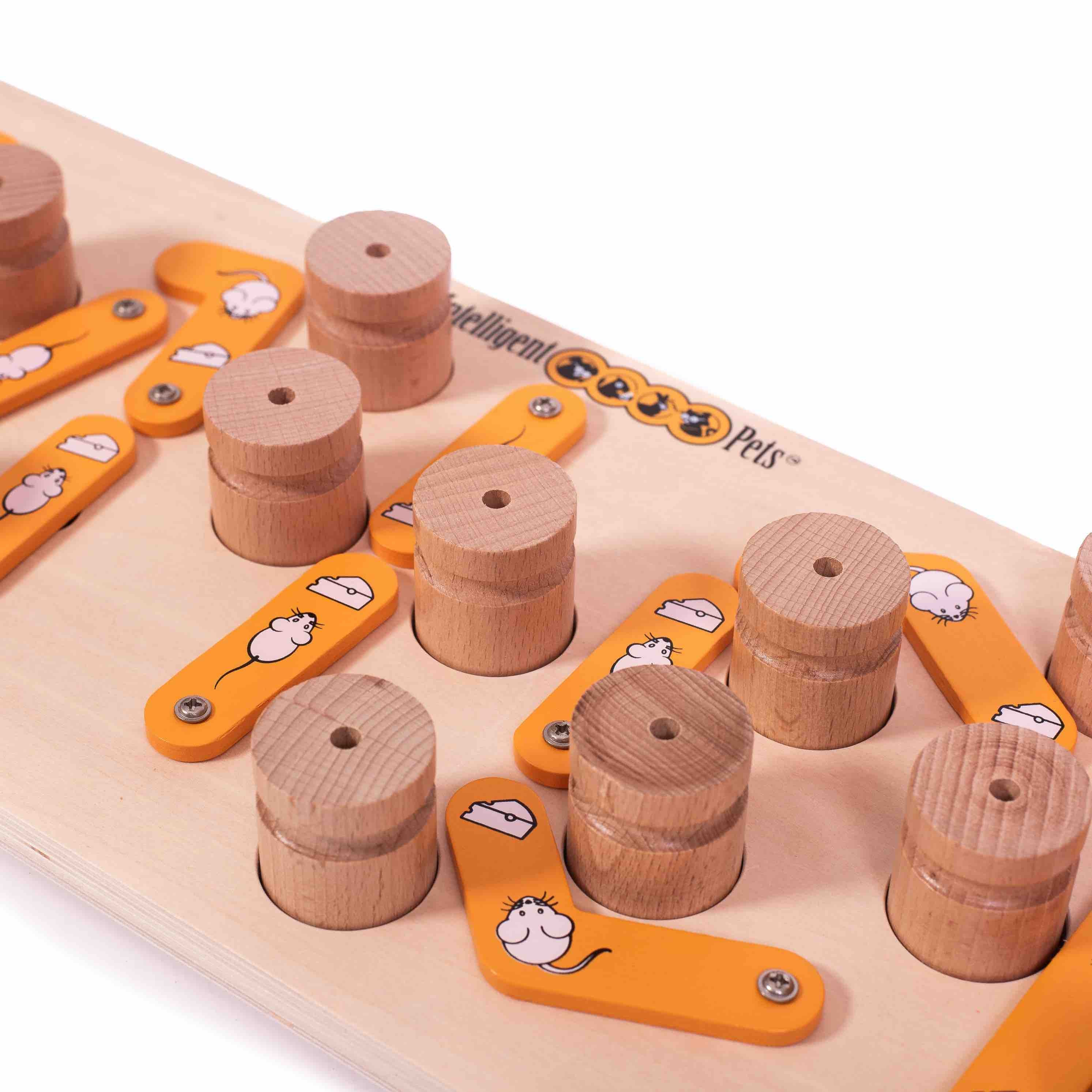 Wooden puzzle with cylindrical wooden blocks and orange plastic pieces on a white background.