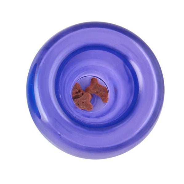 Purple pet toy with a central hole containing dog treats on a white background.