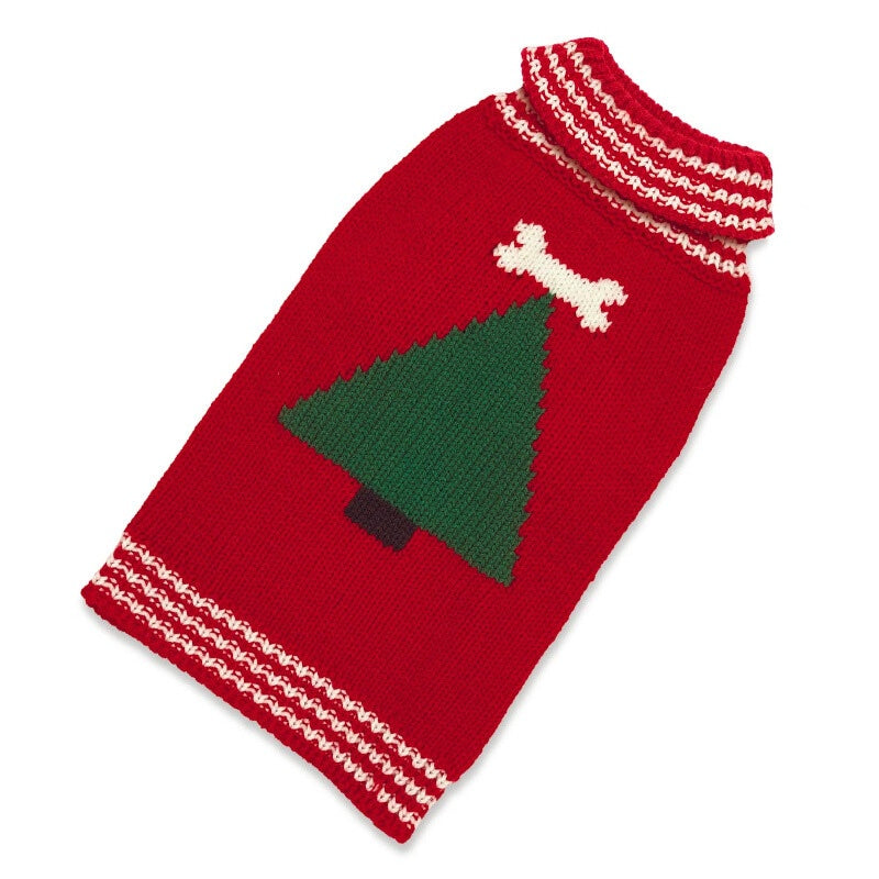 Red knitted dog sweater with green tree and white bone design on a white background